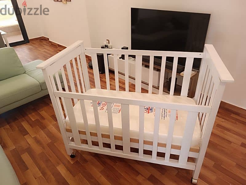Brand New Crib With Mattress. 28x52 inches & 42 inches in height, 1