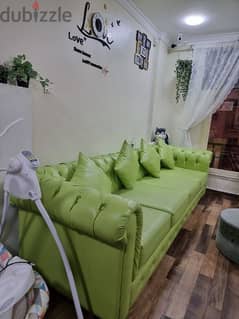less used sofa set,leather covering with 4 pillow,ph. 50872237