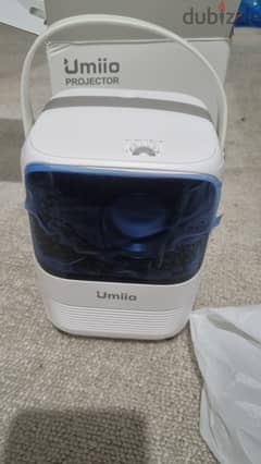 Umiio Projector selling its brand new. Only box open