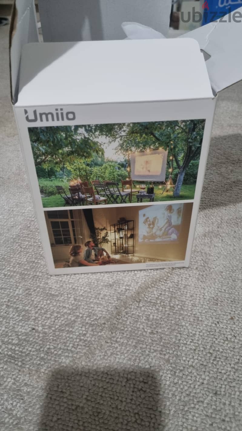 Umiio Projector selling its brand new. Only box open 4