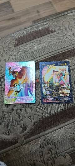 2 rarePokémon cards black and rainbow colour