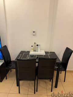 Black dinning table with 4 chairs
