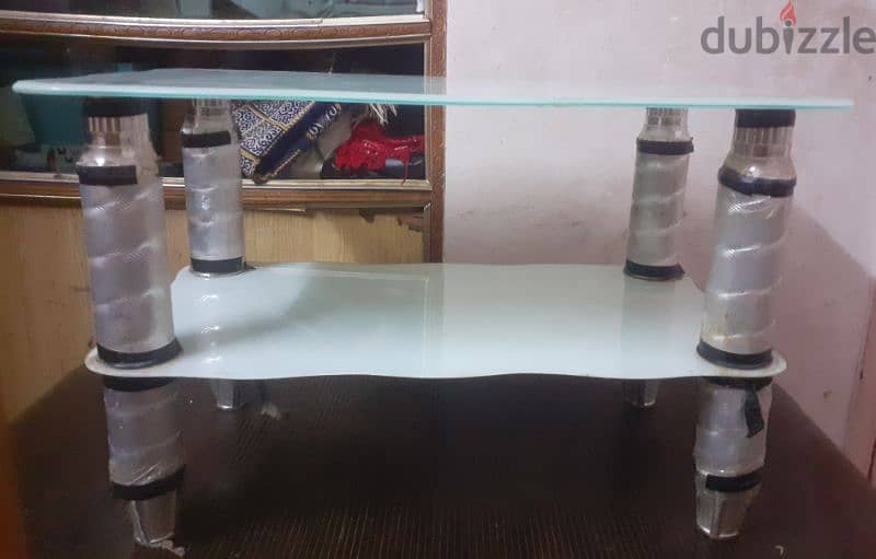 light blue glass table about 1.5foot tall 2