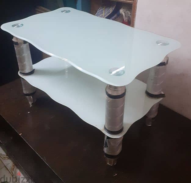 light blue glass table about 1.5foot tall 4