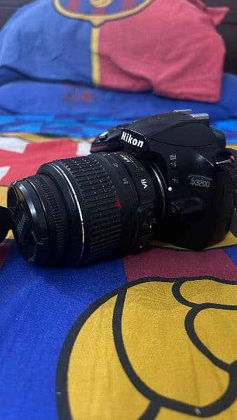 Nikon D3200 with 18-55mm and free accessories. 4