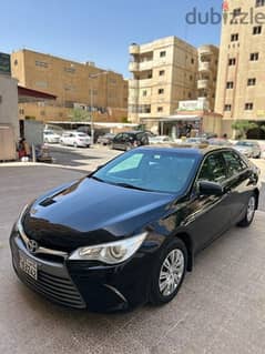 Toyota Camry gl black color vehicle for sale