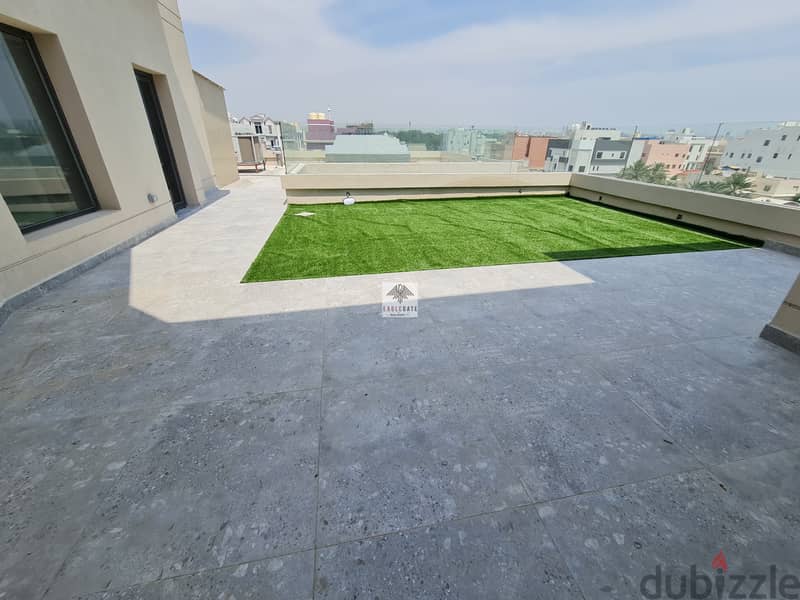 modern 2 bedroom apartment with an open plan kitchen and large rooftop 2