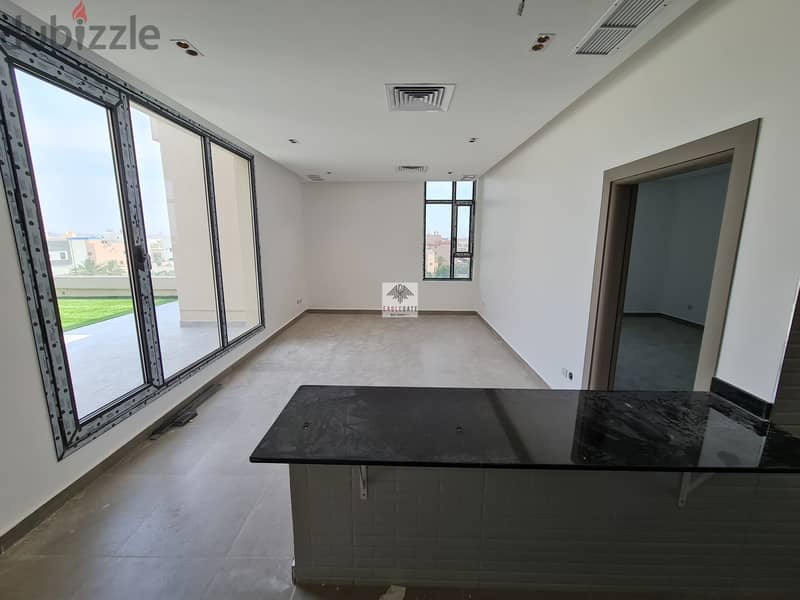 modern 2 bedroom apartment with an open plan kitchen and large rooftop 3