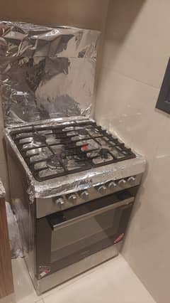 Haier 4 burner stove with oven and grill 0
