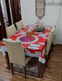 Safat Home Teakwood dining table for Sale with 5 leather chairs.