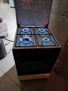 4-burner gas cooker with blue flame and oven underneath only