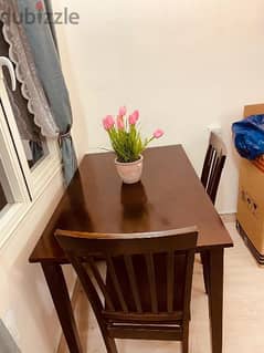 well maintained Dining table for sale along with 2 chair
