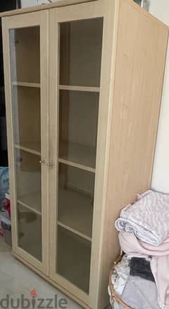 wooden cabinet with glass doors 0