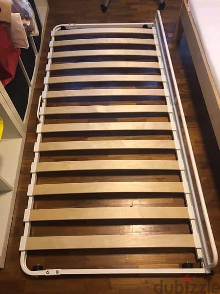 Moveable IKEA under bed frame with mattress. 0
