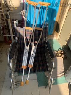wheel chair and two  sticks for sale