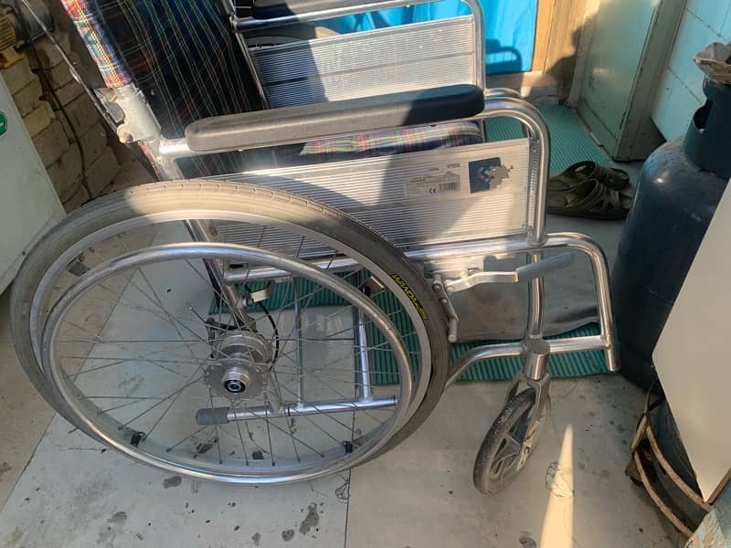 wheel chair and two  sticks for sale 2