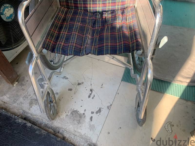 wheel chair and two  sticks for sale 4