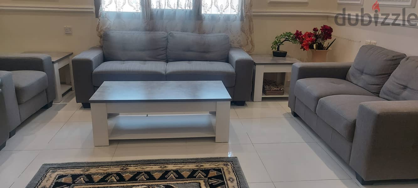 Almost new sofa set with a center table and 2 side tables. 0