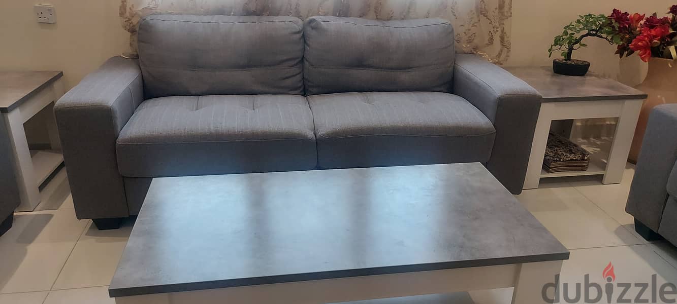 Almost new sofa set with a center table and 2 side tables. 2