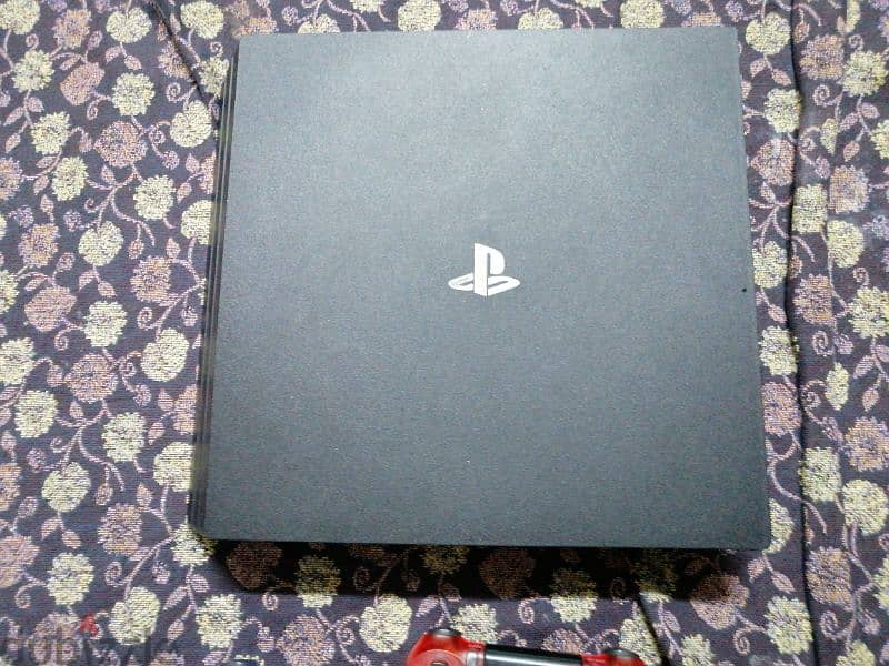 PS4 Pro with 3 controllers, power cable, hdmi cable and a long charger 1