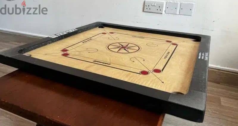 Carrom board with coins. 1