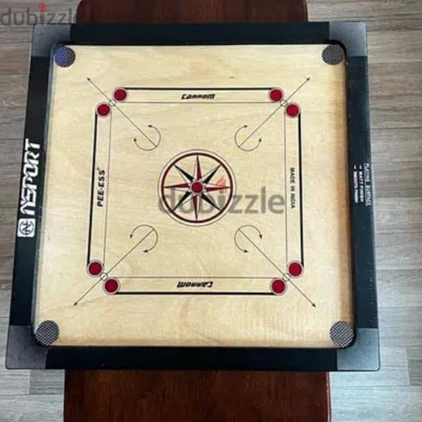 Carrom board with coins. 2