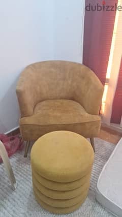 yellow comfortable sofa with a cushion table type of thing