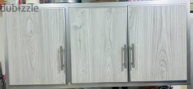 kitchen cabinets with plate rack and breakfast table