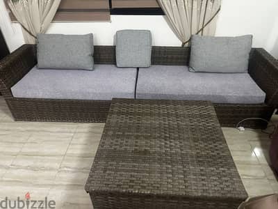 Outdoor/indoor sofa with storage table