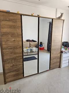 4 partition wardrobe with multiple shelves. and 2 full length mirrors