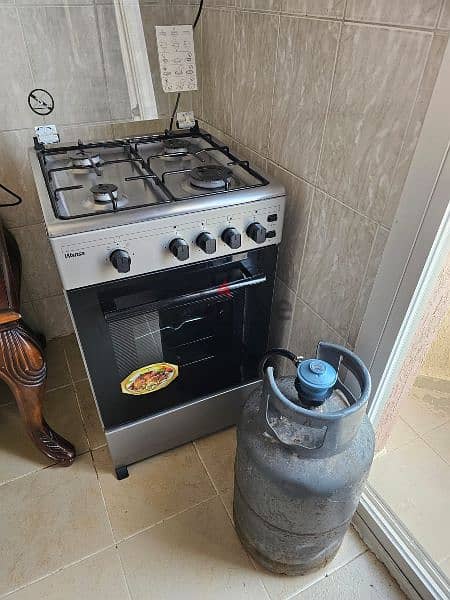 4 burner cooking range with a overhead for exhaust and gas cylinder 2