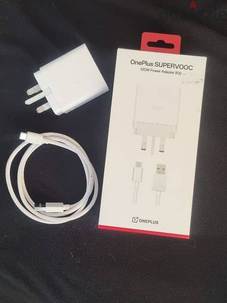 One plus 100 wt supervooc charger. 4 months used fresh condition 1