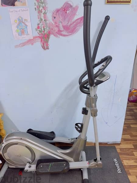 Wansa Elliptical fitness machine with Reebok mat 1