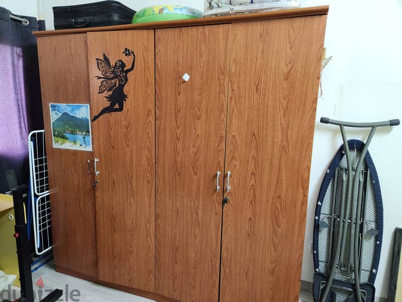 four door wooden cupboard 0