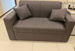 2 sitter sofa available for sale