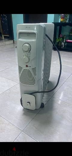 Midea 11 fins heavy oil heater less used like new 0