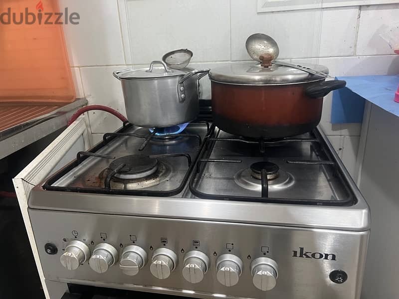 Cooking range with four burner an automatic ignition 1