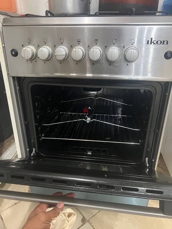 Cooking range with four burner an automatic ignition 3