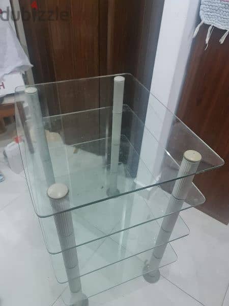 glass table four shelves in excellent condition 0