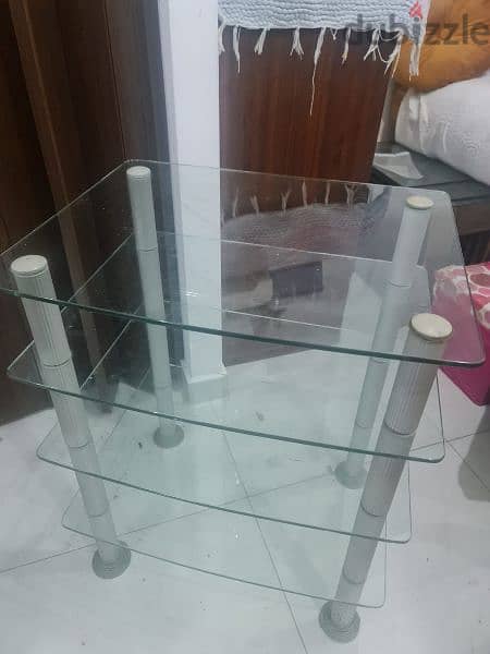 glass table four shelves in excellent condition 1