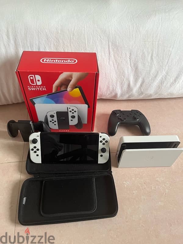 very new Nintendo OLED , did not use much ,+pro controller+5games 0