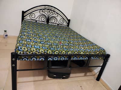 Metal cot with mattress