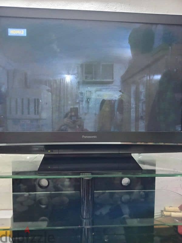 panasonic tv and tv stand for sale 0