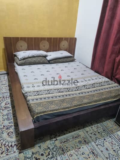 Wooden queen size bed with mattress