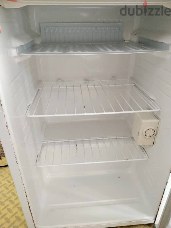 For sale, a small Daewoo refrigerator in excellent condition. 1