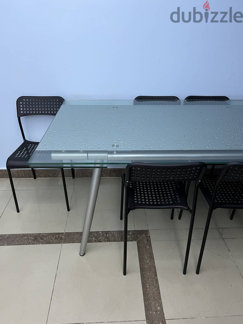 Stylish Glass Dining Table with Extendable Sides 1