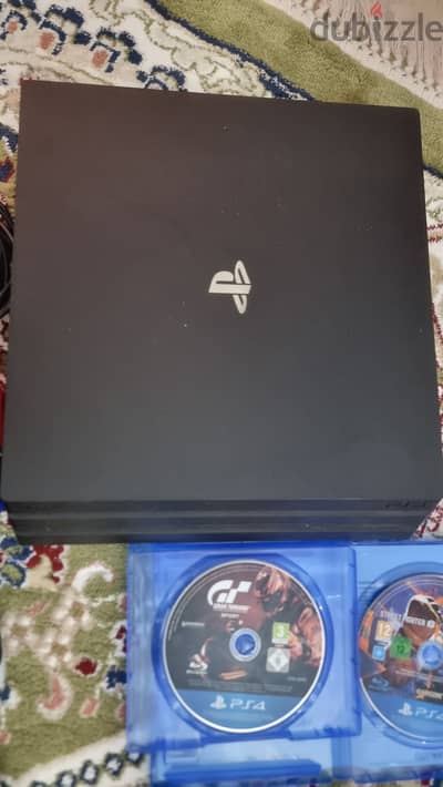 PS4 Pro with 4 controllers, 2 controller chargers and 3 games