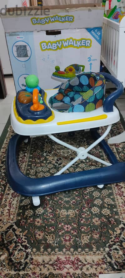 Baby walker with music and rhythm. Good condition.