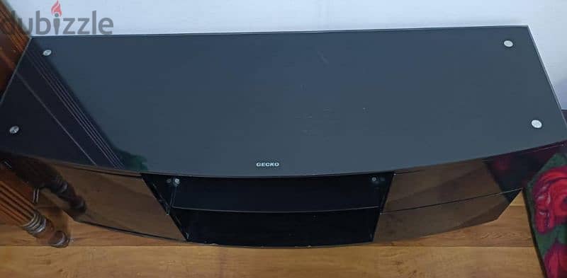 black glass tv cabinet in good  condition 0