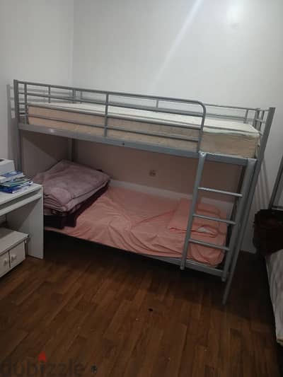 Iron bunk bed with mattresses in good condition